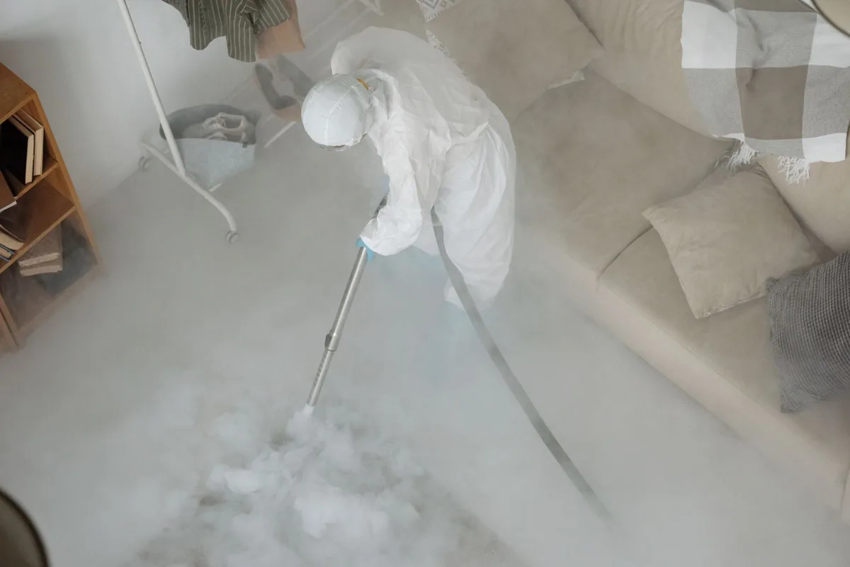 Biohazard cleanup technician in protective equipment, Arlington, MA
